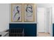 bedroom with crib, door and abstract art at 2901 Protagonist St, Kissimmee, FL 34746