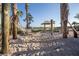 Relaxing hammock area with sand, palm trees, and a gazebo at 2901 Protagonist St, Kissimmee, FL 34746