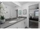 Double vanity bathroom with gray counters and a view of a bedroom at 2901 Protagonist St, Kissimmee, FL 34746