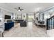 Open concept dining room with large table and view of living room at 2901 Protagonist St, Kissimmee, FL 34746