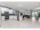Open concept kitchen with stainless steel appliances and island at 2901 Protagonist St, Kissimmee, FL 34746