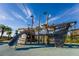 playground with pirate ship theme, slide, and climbing features at 2901 Protagonist St, Kissimmee, FL 34746