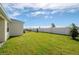 Spacious backyard with grassy area and privacy fence at 1991 Spring Shower Cir, Kissimmee, FL 34744