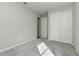Well-lit bedroom featuring plush carpeting and a double door closet at 1991 Spring Shower Cir, Kissimmee, FL 34744