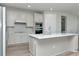 Modern kitchen with island, stainless steel appliances, and breakfast nook at 1991 Spring Shower Cir, Kissimmee, FL 34744