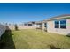 Spacious backyard with grassy lawn, privacy fence, and patio at 1991 Spring Shower Cir, Kissimmee, FL 34744