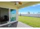 Patio with sliding glass doors leading to backyard at 1991 Spring Shower Cir, Kissimmee, FL 34744