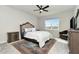 Comfortable bedroom with a king-size bed and ceiling fan at 1991 Spring Shower Cir, Kissimmee, FL 34744