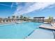 Inviting community pool with a pergola and lounge chairs at 1991 Spring Shower Cir, Kissimmee, FL 34744