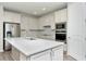 Modern kitchen with stainless steel appliances and white cabinets at 1991 Spring Shower Cir, Kissimmee, FL 34744