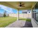 Covered patio with ceiling fan overlooking a fenced backyard at 1991 Spring Shower Cir, Kissimmee, FL 34744