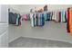 Spacious walk-in closet with ample hanging space and shelving at 1991 Spring Shower Cir, Kissimmee, FL 34744