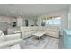 Spacious living room featuring a large sectional sofa and modern coffee table at 1991 Spring Shower Cir, Kissimmee, FL 34744