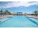 Resort-style community pool with plenty of lounge chairs at 1991 Spring Shower Cir, Kissimmee, FL 34744