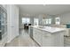 Modern kitchen with island, stainless steel appliances, and breakfast nook at 1991 Spring Shower Cir, Kissimmee, FL 34744
