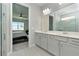 Spa-like bathroom with double vanity and access to walk-in shower and bedroom at 1991 Spring Shower Cir, Kissimmee, FL 34744