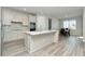 Modern kitchen with island, stainless steel appliances, and breakfast nook at 1991 Spring Shower Cir, Kissimmee, FL 34744