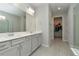 Elegant bathroom with double vanity and large walk-in shower at 1991 Spring Shower Cir, Kissimmee, FL 34744
