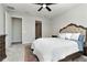 Bright bedroom with king-size bed, carpet, and access to bathroom at 1991 Spring Shower Cir, Kissimmee, FL 34744