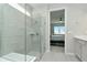 Bathroom featuring a walk-in shower and view into bedroom at 1991 Spring Shower Cir, Kissimmee, FL 34744