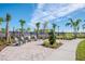 Relaxing poolside patio with lounge chairs and landscaping at 1991 Spring Shower Cir, Kissimmee, FL 34744
