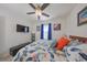 Bright bedroom with ceiling fan and large window at 5394 Arlington River Dr, Lakeland, FL 33811