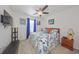 Spacious bedroom with ceiling fan and large window at 5394 Arlington River Dr, Lakeland, FL 33811