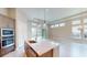 Modern kitchen with island, stainless steel appliances, and white quartz countertops at 128 Mosaic Blvd, Daytona Beach, FL 32124