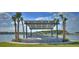 Lakeside gazebo with stone seating and pergola at 128 Mosaic Blvd, Daytona Beach, FL 32124
