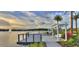 Lakefront deck with seating and pergola, fire pit at 128 Mosaic Blvd, Daytona Beach, FL 32124