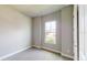 Bright bedroom with neutral walls, carpet flooring, and a window with a view at 128 Mosaic Blvd, Daytona Beach, FL 32124
