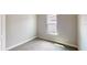 Simple bedroom with neutral walls, carpet flooring, and a window with natural light at 128 Mosaic Blvd, Daytona Beach, FL 32124