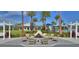 Community fire pit with seating and palm trees at 128 Mosaic Blvd, Daytona Beach, FL 32124