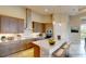 Modern kitchen with light wood cabinets, stainless steel appliances, and a large island at 128 Mosaic Blvd, Daytona Beach, FL 32124
