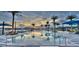 Resort-style pool with palm trees and lounge chairs at 128 Mosaic Blvd, Daytona Beach, FL 32124