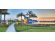 Community entrance with a mosaic sign and fountains at 128 Mosaic Blvd, Daytona Beach, FL 32124