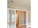 Bright hallway with double French doors and hardwood floors at 128 Mosaic Blvd, Daytona Beach, FL 32124