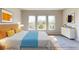 Spacious bedroom with wood-look floors and large windows offering natural light at 128 Mosaic Blvd, Daytona Beach, FL 32124