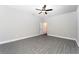 Bright bedroom featuring grey flooring and a ceiling fan at 3327 Chinotto Dr, Lake Alfred, FL 33850