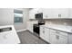 Modern kitchen with white cabinets and quartz countertops at 3327 Chinotto Dr, Lake Alfred, FL 33850