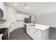 Open concept kitchen with island and stainless steel appliances at 3327 Chinotto Dr, Lake Alfred, FL 33850