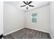 Cozy bedroom featuring grey carpet and a ceiling fan at 3327 Chinotto Dr, Lake Alfred, FL 33850