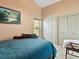 Bright bedroom with double doors leading to a large closet at 10820 Sw 31St Way, Webster, FL 33597