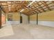 Spacious garage with high ceilings, concrete floor, and ample storage at 10820 Sw 31St Way, Webster, FL 33597
