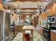 Open kitchen with stainless steel appliances and wood cabinets at 10820 Sw 31St Way, Webster, FL 33597