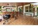Outdoor kitchen with a bar, grill, and ample counter space at 10820 Sw 31St Way, Webster, FL 33597