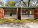 Large double-door garage with wood accents at 10820 Sw 31St Way, Webster, FL 33597