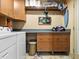 Laundry room with washer, dryer, and cabinets at 10820 Sw 31St Way, Webster, FL 33597