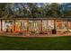 Expansive covered patio with fire pit, perfect for outdoor entertaining at 10820 Sw 31St Way, Webster, FL 33597