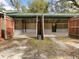 Double-door garage with open doors, revealing interior at 10820 Sw 31St Way, Webster, FL 33597